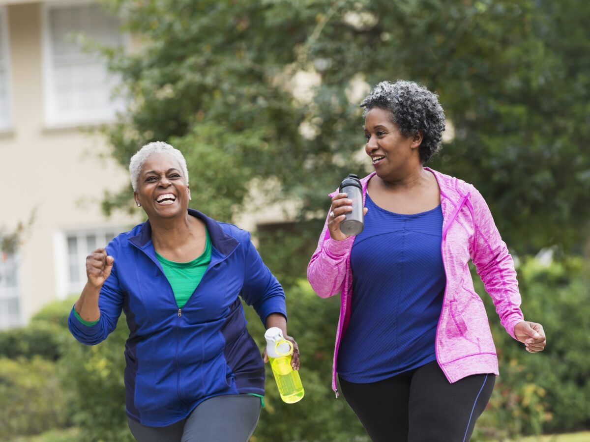 Happy healthy women walking outside